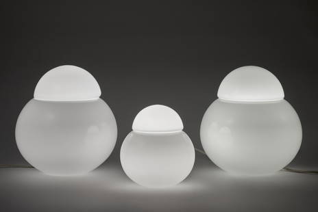 Sergio Asti (Milano 1926 - 2021) * Three table lamps model "Daruma". Produced by Candle, Italy,: Sergio Asti (Milano 1926 - 2021) * Three table lamps model "Daruma". Produced by Candle, Italy, 1966. Diffuser composed of two spherical caps of different diameters made of lattimo glass. (h cm 20 e 3