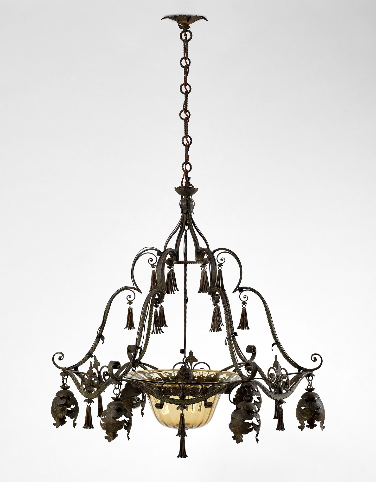 Carlo Rizzarda (Feltre 1883 - 1931) Seven-light forged iron chandelier patinated green with embossed: Carlo Rizzarda (Feltre 1883 - 1931) Seven-light forged iron chandelier patinated green with embossed foil leaf-shaped lampshades, pagliesque blown glass shade by MVM Cappellin manufactory, Murano, dec