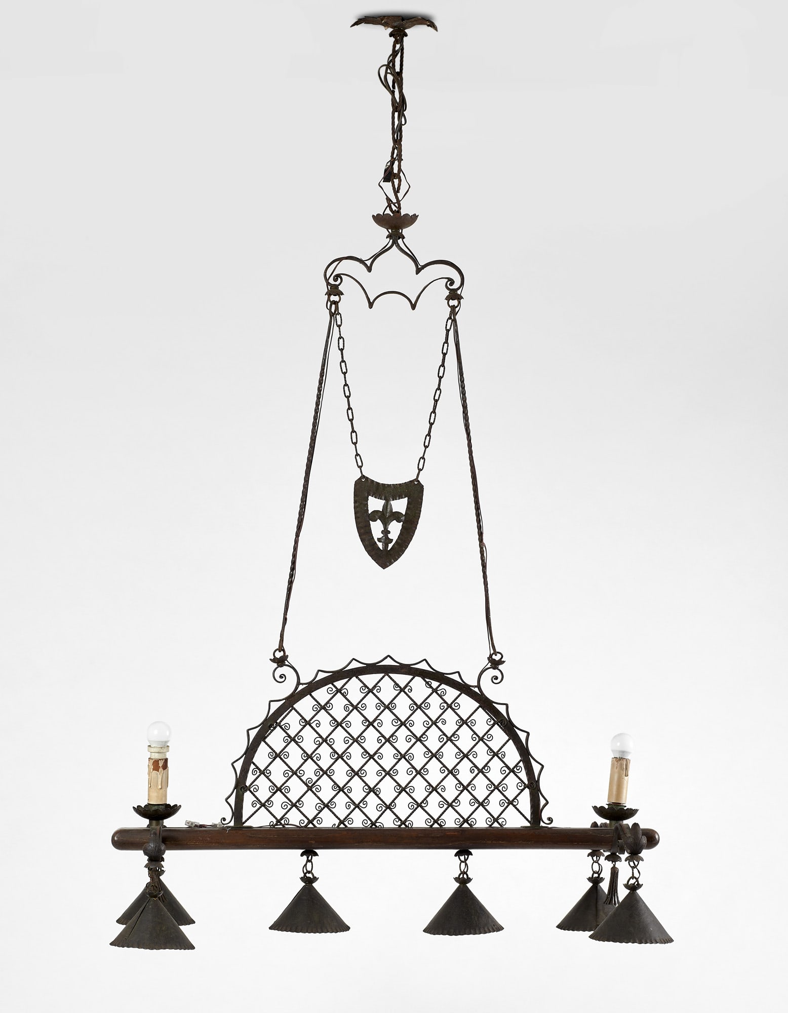 Carlo Rizzarda (Feltre 1883 - 1931) Eight-light pendant lamp made of green-patinated forged iron and: Carlo Rizzarda (Feltre 1883 - 1931) Eight-light pendant lamp made of green-patinated forged iron and solid wood decorated with a shield framing a lily in embossed foil, a star-studded trellis arch in