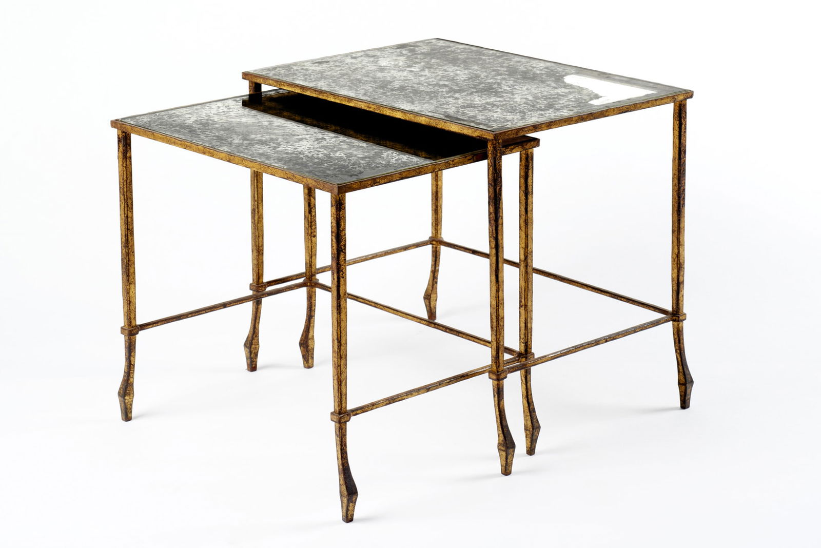 Two gilt iron nesting tables with mirrored tops. France, 20th century. (cm 47x41x34.5 e 42x39x31.5) (1 of 1)