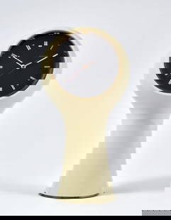 Angelo Mangiarotti (1921 - 2012) e Bruno Morassutti (1920 - 2008) Milk-white plastic table clock: Angelo Mangiarotti (1921 - 2012) e Bruno Morassutti (1920 - 2008) Milk-white plastic table clock model 'T1' of the series "Secticon". Produced by Le Porte-Échappement Universel, Swiss, 1956. (h 25 cm