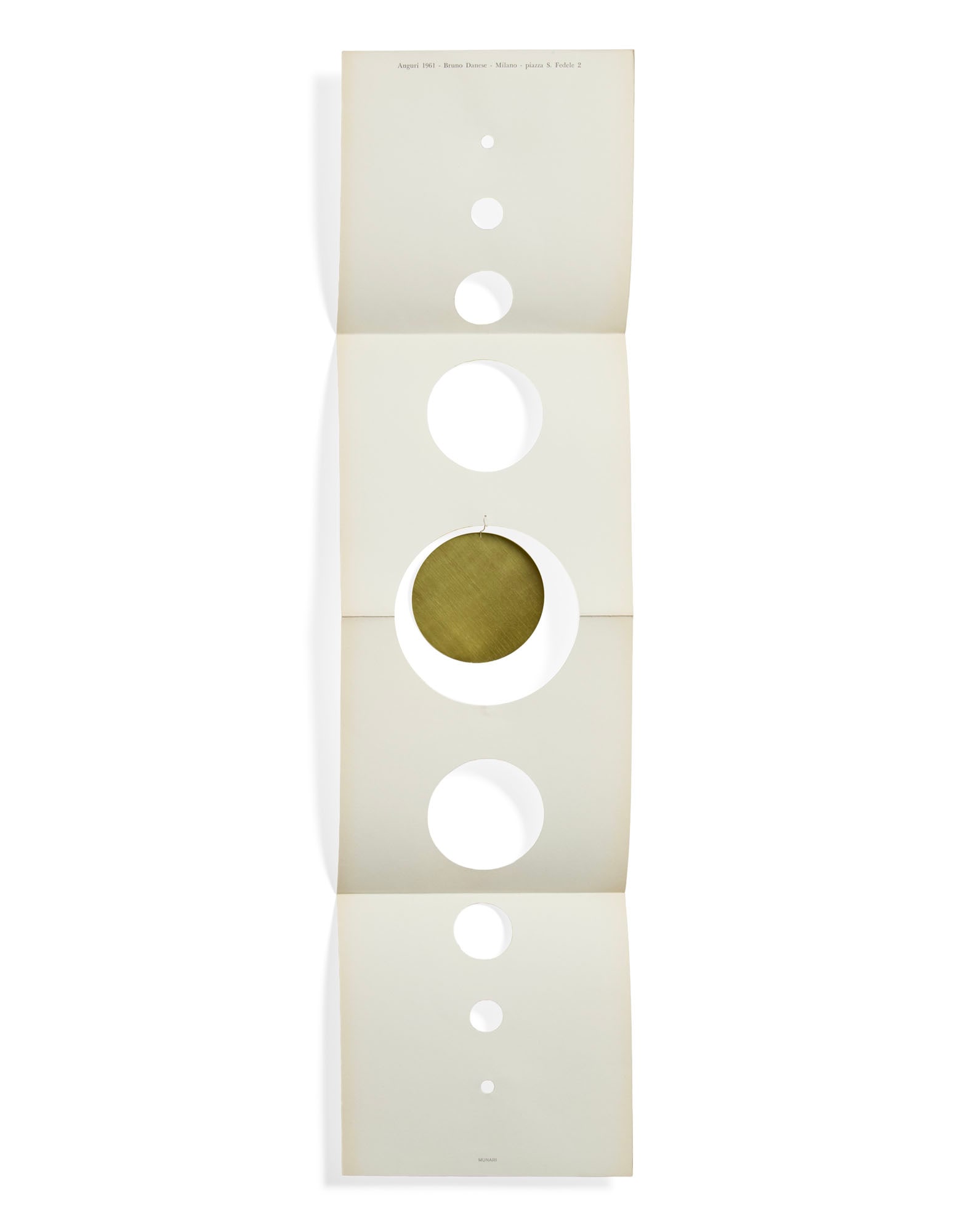 Bruno Munari (Milano 1907 - 1998) Greeting card. Execution by Danese, Milan, 1961. Folded cardboard: Bruno Munari (Milano 1907 - 1998) Greeting card. Execution by Danese, Milan, 1961. Folded cardboard cut-out with round gold foil hanging decoration, inspired by "macchine inutili". Inscription "Auguri