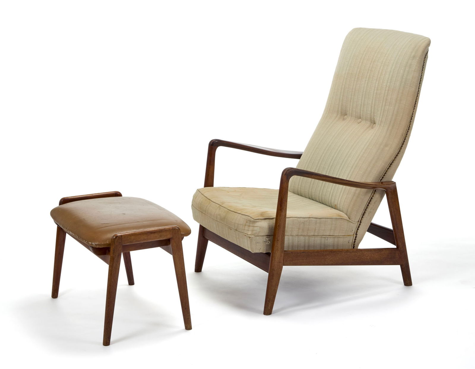 Arnestad Bruk Reclining armchair with ottoman model "829". Produced by Cassina, Meda, 1961ca. Solid: Arnestad Bruk Reclining armchair with ottoman model "829". Produced by Cassina, Meda, 1961ca. Solid wood and studded fabric, footrest covered in brown faux leather. Bearing the manufacturer's mark. (a