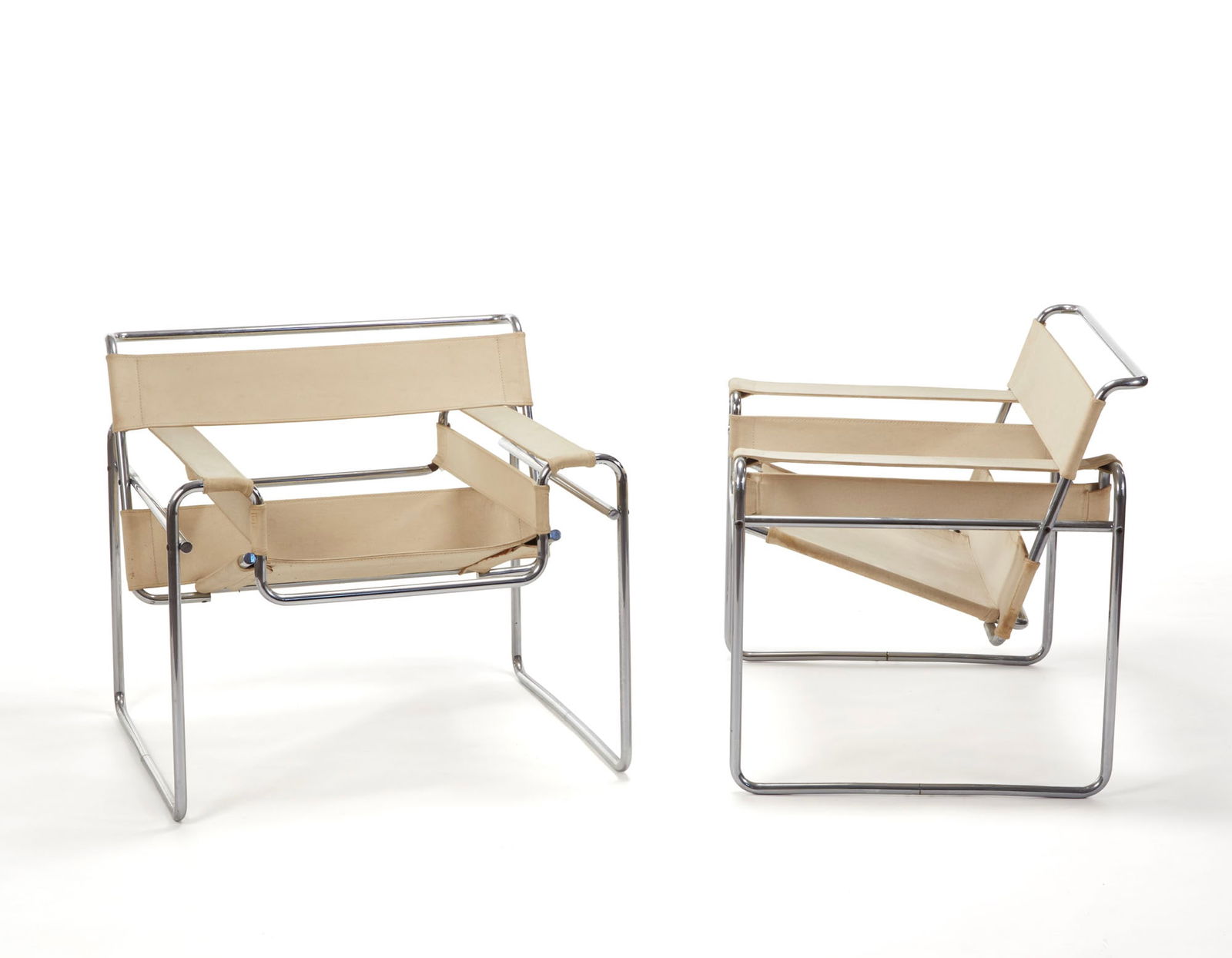 Marcel Breuer (Pécs 1902 - New York 1981) Pair of armchairs model "B3" or "Wassily". Produced by: Marcel Breuer (Pécs 1902 - New York 1981) Pair of armchairs model "B3" or "Wassily". Produced by Knoll International, Zurich, 1970s. Chrome-plated steel tube and white fabric. Bearing the manufacture