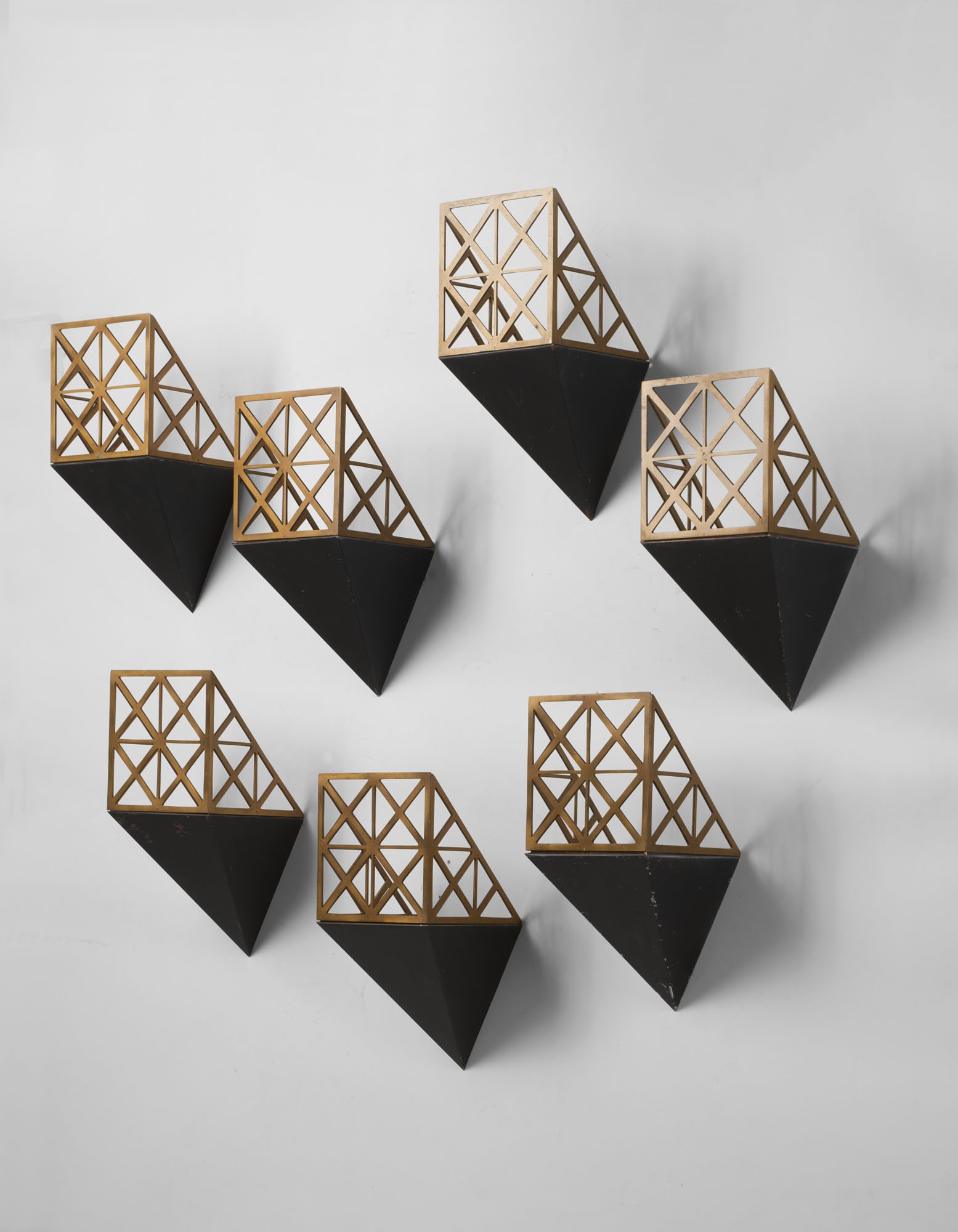 Luca Scacchetti (Milano 1952 - 2015) Seven wall lamps in brass foil and cast brass. Milan, 1980s. (1 of 1)