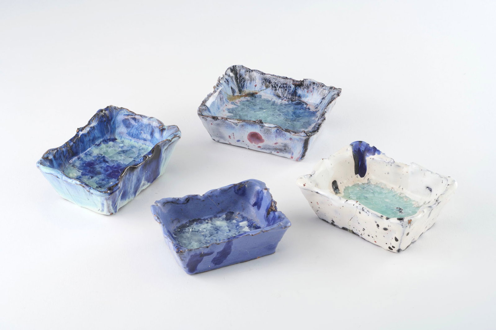 Fausto Melotti (Rovereto 1901 - Milano 1986) Ashtrays. 1955ca. Polychrome glazed pottery. One signed (1 of 8)