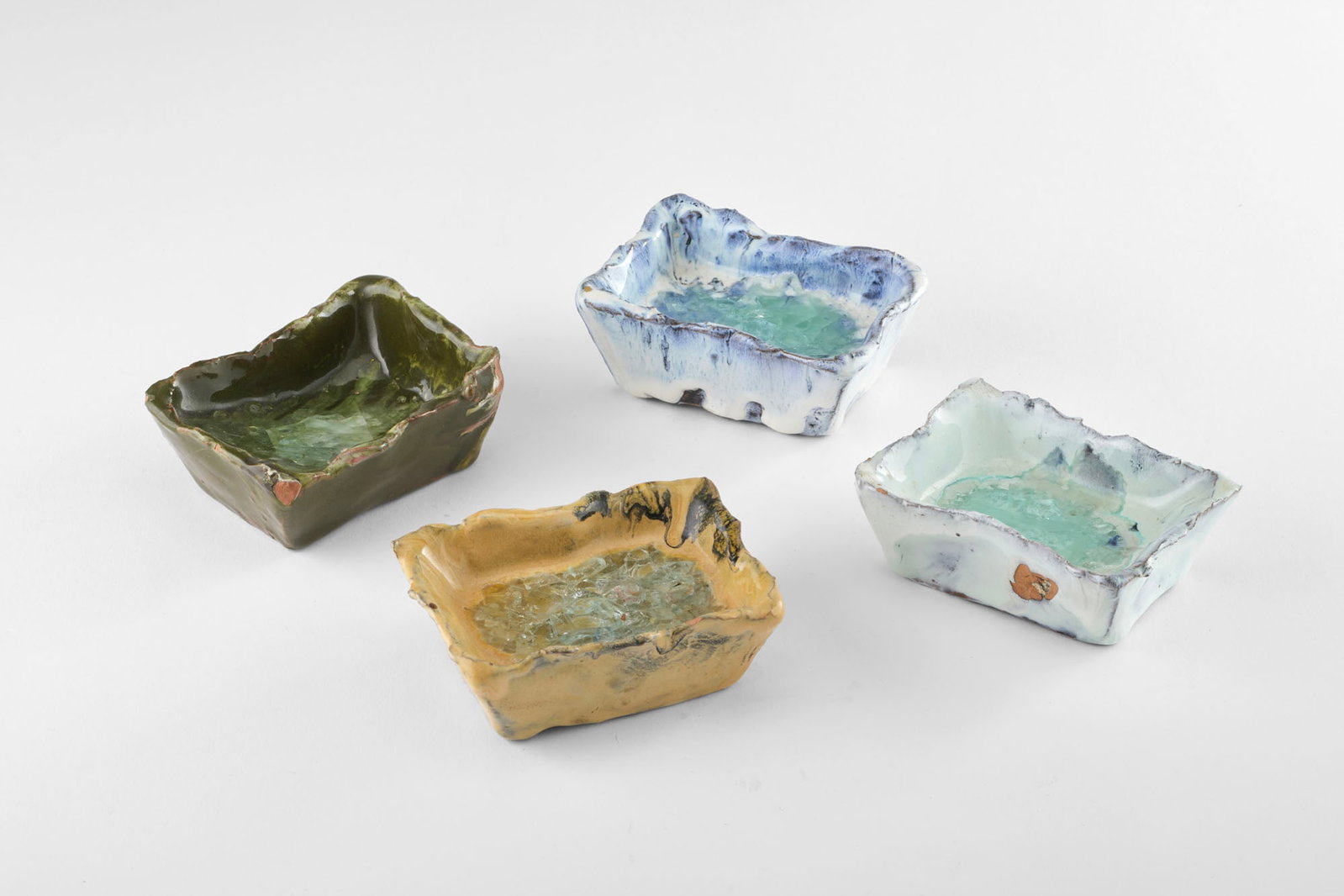 Fausto Melotti (Rovereto 1901 - Milano 1986) Ashtrays. 1955ca. Polychrome glazed ceramic. One signed: Fausto Melotti (Rovereto 1901 - Milano 1986) Ashtrays. 1955ca. Polychrome glazed ceramic. One signed under the base with seven points. (3x9x7 cm.) (slight defects) Work registered with the Fondazione 