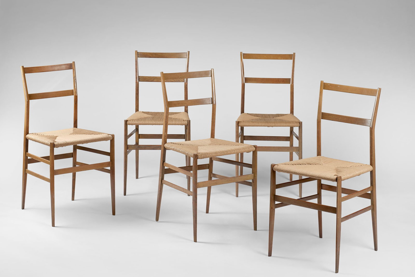 Gio Ponti (Milano 1891 - 1979) Five chairs model "Superleggera". Produced by Cassina, Meda, 1957.: Gio Ponti (Milano 1891 - 1979) Five chairs model "Superleggera". Produced by Cassina, Meda, 1957. Natural-stained ash wood and a seat made of non-matching rope. (slight defects) Literature G. Gramigna