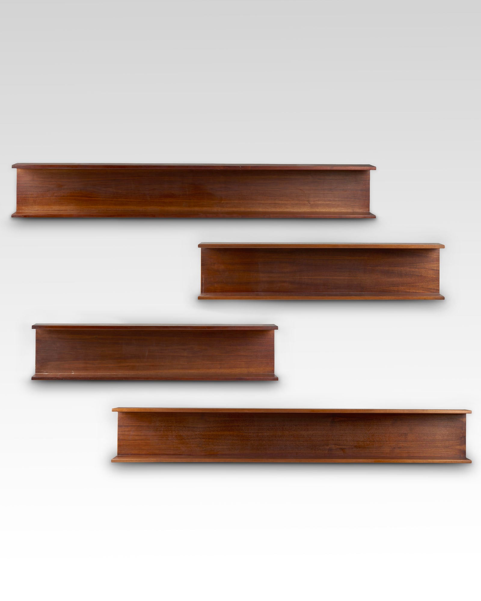 Eugenio Gerli (Milano 1923 - 2013) (Attributed) Two pairs of solid wood wall-mounted bookcases.: Eugenio Gerli (Milano 1923 - 2013) (Attributed) Two pairs of solid wood wall-mounted bookcases. Milan, 1964ca. (two 199.5 x 29 x 19 cm units and two 130 x 29 x 19 cm units) (defects) Provenance House 