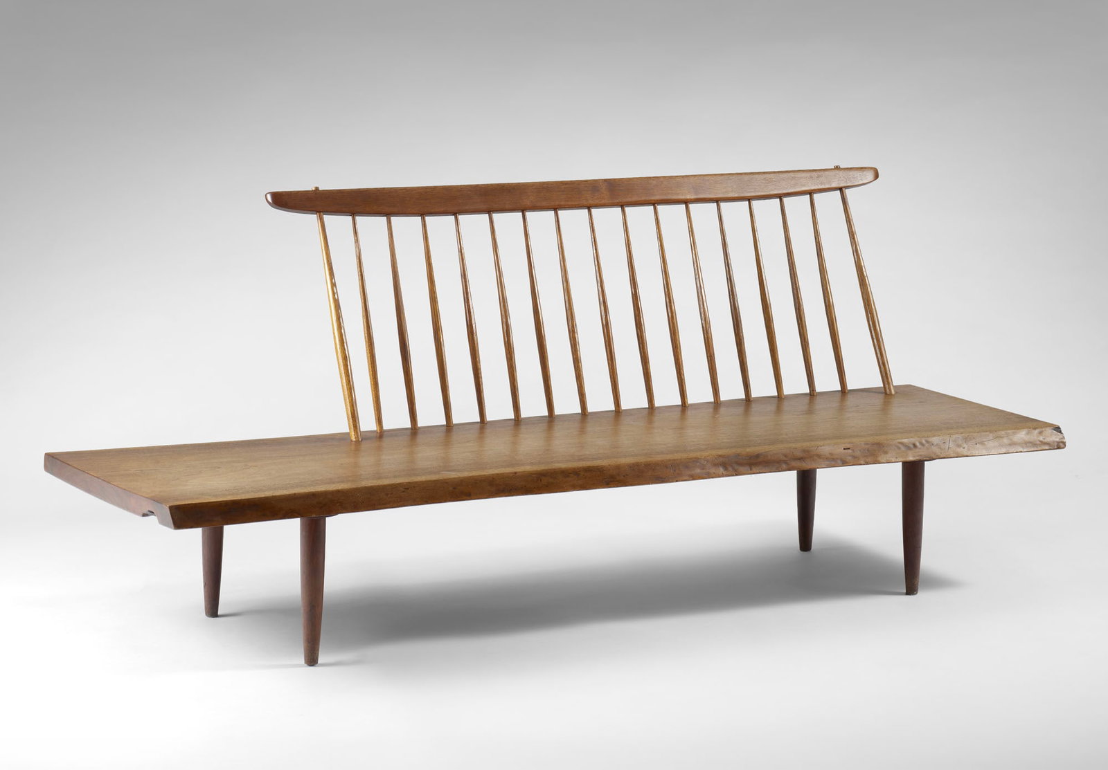 George Nakashima (Spokane (Washington) 1905 - New Hope (Pennsylvania) 1990) "Conoid Bench" Bench. (1 of 2)