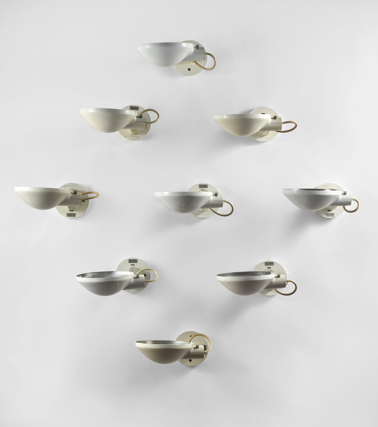 Nine “Concord?? Wall Lights model "T04962". Italy, 1970s. White lacquered metal. (d 19 cm.) (1 of 1)
