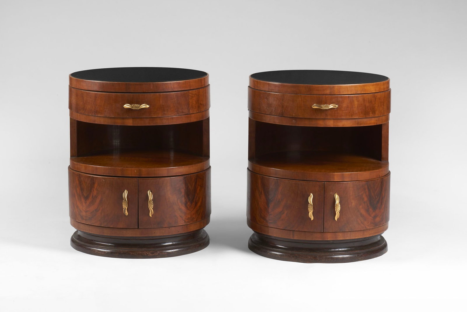 Pair of Art Deco bedside tables. Italy, 1930s. Solid wood and burl veneer. Cylindrical body with two (1 of 1)