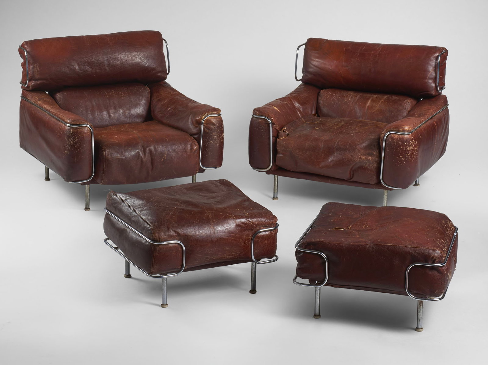 Vittorio Introini (1935 - 2023) Pair of armchairs with ottomans model "Franzy". Produced by (1 of 1)