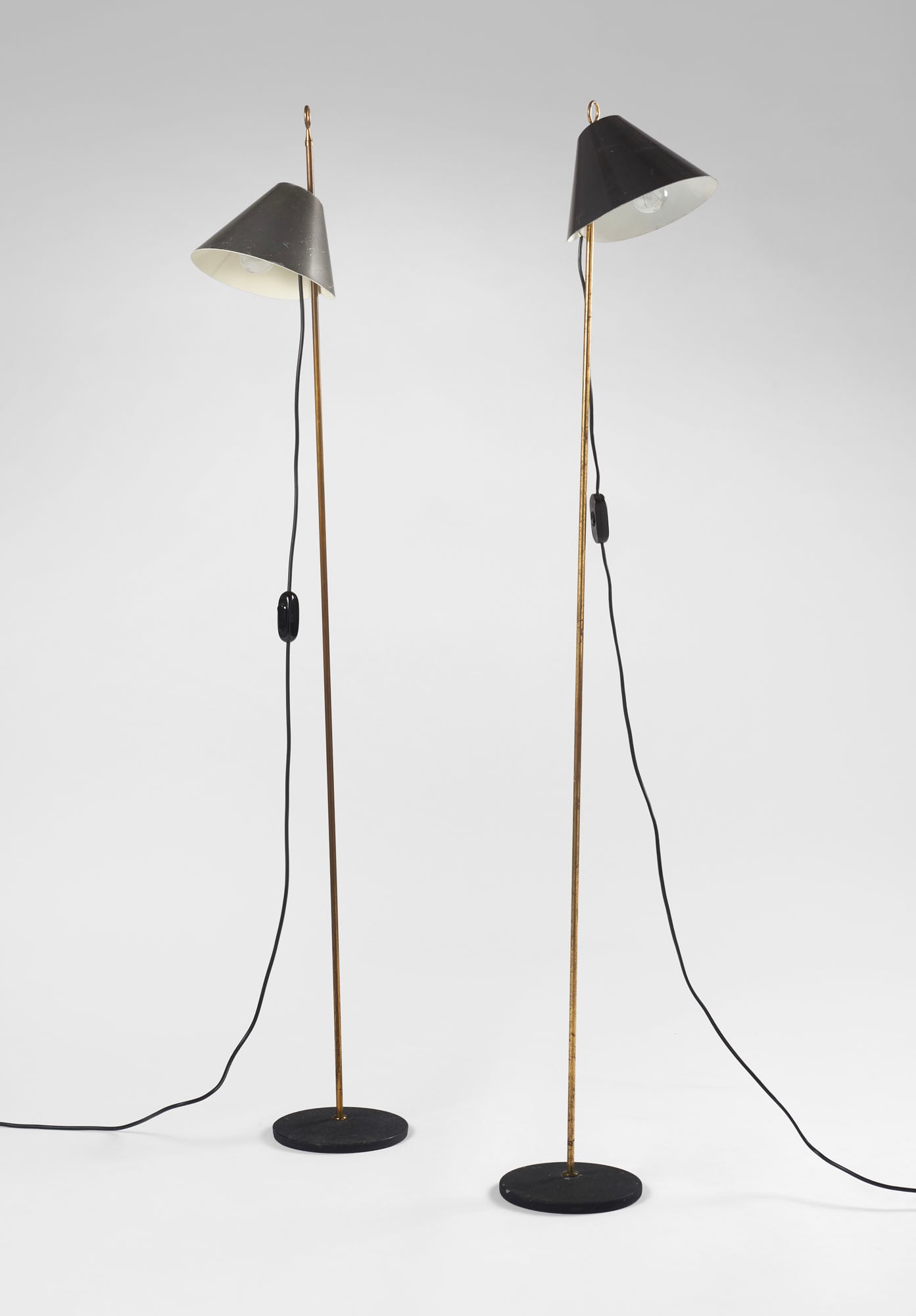 Luigi Caccia Dominioni (Milano 1913 - 2016) * Pair of floor lamps model "LTE4 Monachella". Produced: Luigi Caccia Dominioni (Milano 1913 - 2016) * Pair of floor lamps model "LTE4 Monachella". Produced by Azucena, Milan, 1960sca. Cast iron, brass, and aluminum. The cap is painted in dark metallic gray