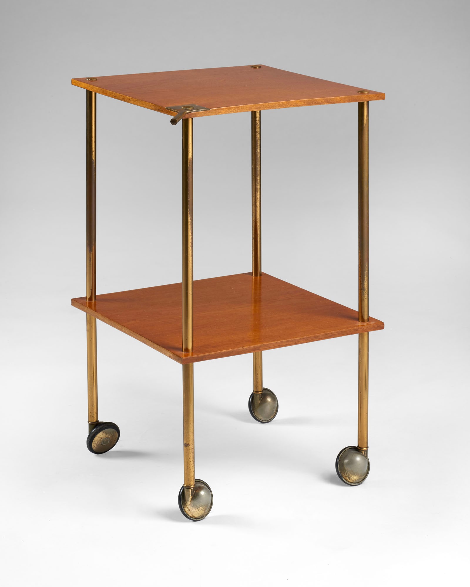 Luigi Caccia Dominioni (Milano 1913 - 2016) * Trolley with two shelves model "T9". Produced by: Luigi Caccia Dominioni (Milano 1913 - 2016) * Trolley with two shelves model "T9". Produced by Azucena, Milan, 1960s. Wood and brass. (35x60.5x35 cm.) (slight defects) IT * Carrello a due ripiani mode