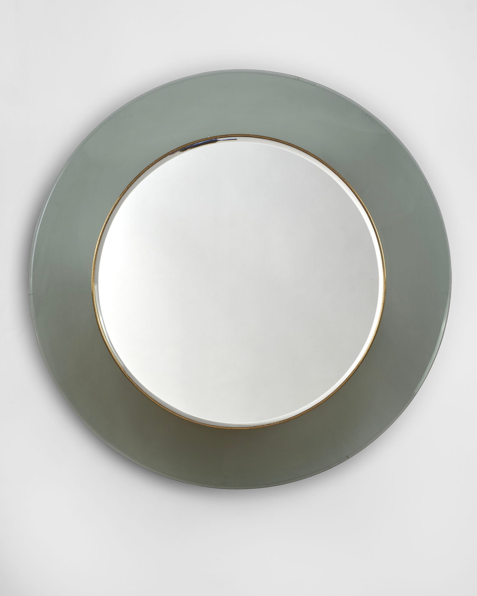 Fontana Arte Circular mirror in smoked bevelled glass with a brass frame model "1669". Milan, 1966. (1 of 1)