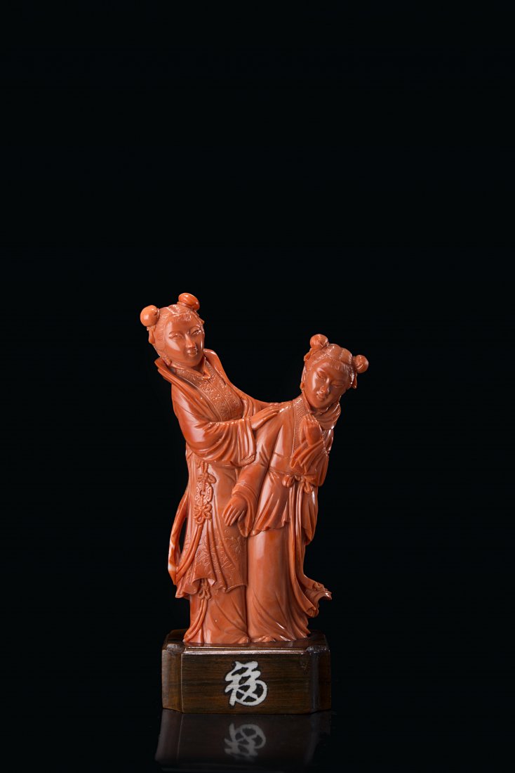 A coral carving of two girls wearing long robes (1 of 1)