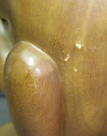 Wood carved sculpture of a figure with head in h - 4