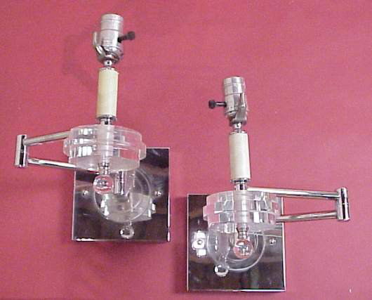 Pr swing arm wall sconces, poss Karl Springer, p: Pr swing arm wall sconces, poss Karl Springer, polished chrome & acrylic, patent #2,729,473, 12"h (minor pitting to one)