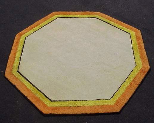 Edward Fields wool carpet, octagon shape with iv: Edward Fields wool carpet, octagon shape with ivory field,black,yellow,& orange border.Marked;Edward Fields Inc.,copyright,1966.Measures 104" x 104". Cond. some stains in the field.