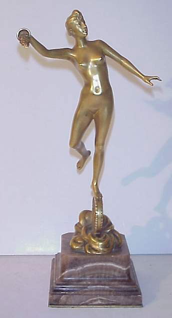 Jean Garnier (French 1853 - 1910) Gilded bronze: Jean Garnier (French 1853 - 1910) Gilded bronze nude figure representing prosperity, balanced on a wheel. set on marble base , signed J . Garnier with a Paris foundry mark 11" h with base.