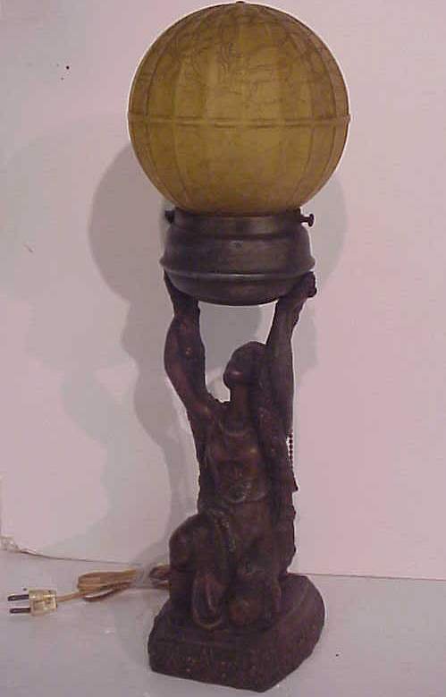 Art Deco lady lamp with amber glass ball shade,
