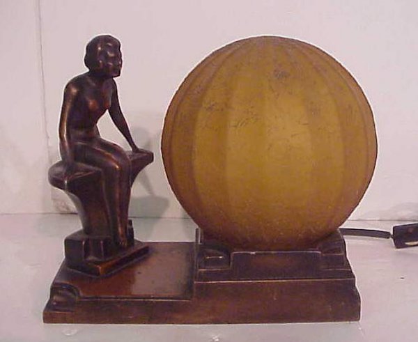 Art Deco seated nude metal lamp with amber glass