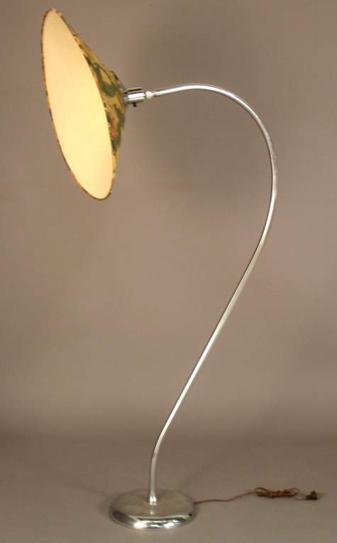 Art Deco floor lamp attrib. to Russel Wright, chr: Art Deco floor lamp attrib. to Russel Wright, chrome plated steel with a large conical shade.The shade can be titled .57 1/2"h.,shade;23 1/2"d.( later socket & power cord ,shade is breaking down ,plat