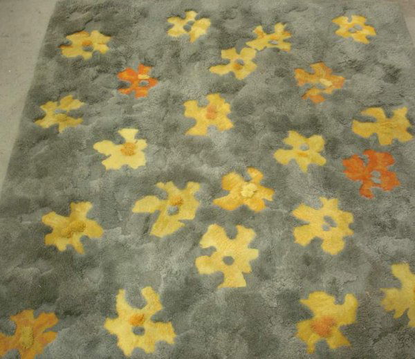 Edward Fields Wool Carpet, C.1968 floral design,t: Edward Fields Wool Carpet, C.1968 floral design,the field is a seafoam green ,with modern floral designs dispersed throughout are yel. to orange & the pile is shorter to give contrast.signed on unders