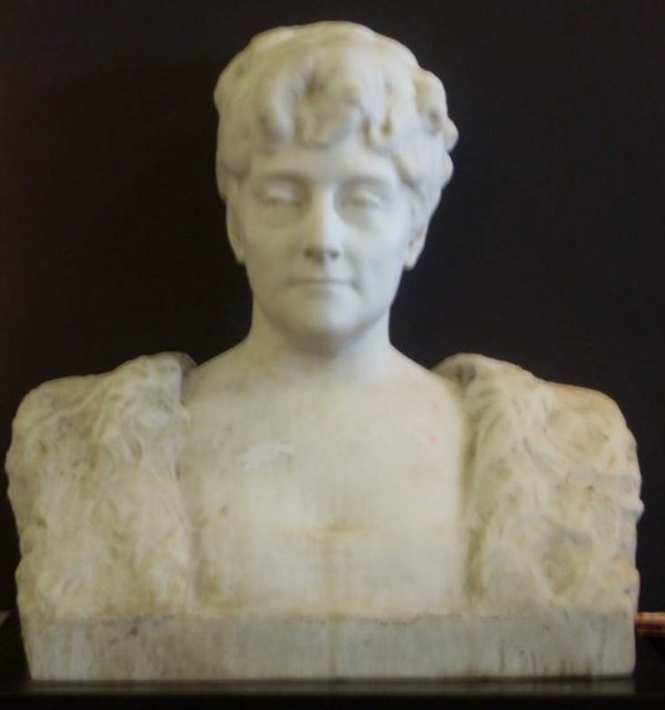 Carved marble bust of a woman, signed illegibly,