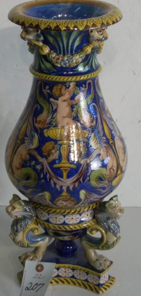 Majolica urn with lions heads and fruit garlands