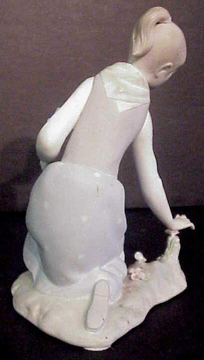 Lladro bisque girl with flowers 9"x5" - 2
