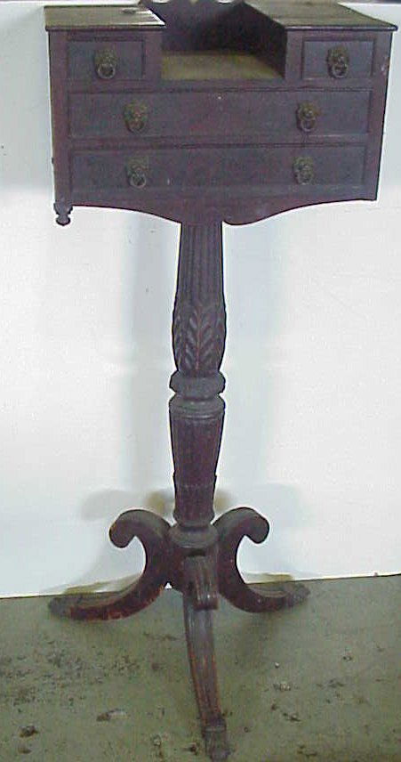 Possibly Duncan Phyfe shaving stand, mahogany, c: Possibly Duncan Phyfe shaving stand, mahogany, columned base, 61"h with harp, 18 1/2"w x 12 1/2"d, brass tips on feet, two over two drawers, pine and polar secondary woods, lion head pulls, lacking mi