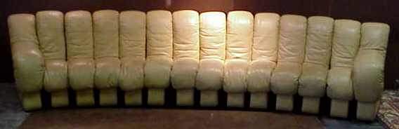 UELI BERGER DS 600 "DE SEDE" TAN LEATHER SOfa: UELI BERGER DS 600 "DE SEDE" TAN LEATHER SOFA, FOR STENDIG MADE IN SWITZERAND, RETAINS ORIGINAL STENDIG LABEL, 14 SECTIONS, OVER 12' LONG, 1972.Leather shows wear,discoloration and small tears.