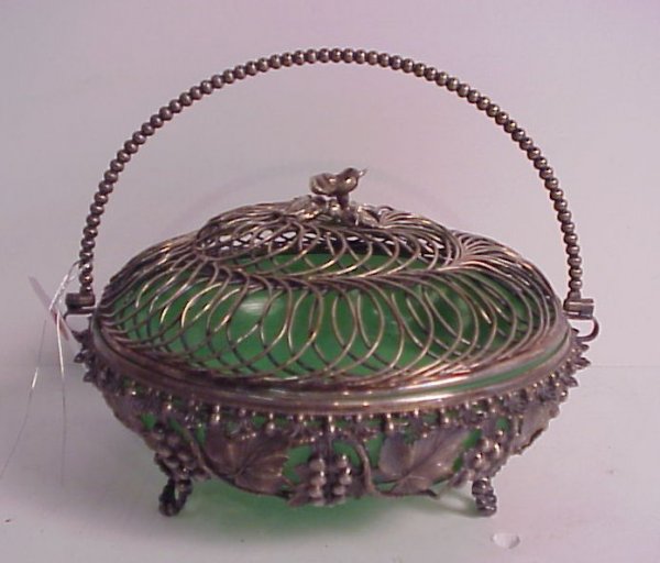 Silverplate footed and lidded basket with leaf des