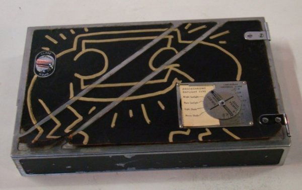 Attributed to Keith Haring Drawing , Ex. Robert M: Attributed to Keith Haring Drawing , Ex. Robert Mapplethorpe On a Kodak movie camera 8 1/4" x 5 1/4" x 1 1/4"