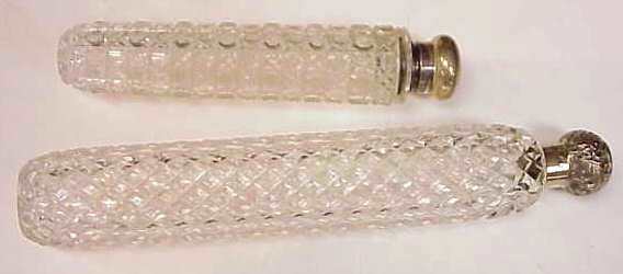 2 STERLING & CRYSTAL PERFUME BOTTLES: GORHAM 7 1: 2 STERLING & CRYSTAL PERFUME BOTTLES: GORHAM 7 1/8"L (MINOR CHIPS TO CRYSTAL) AND ENGLISH HALLMARKED MONOGRAMMED M ON LID 10 1/2"L (MINOR CHIPS TO CRYSTAL)