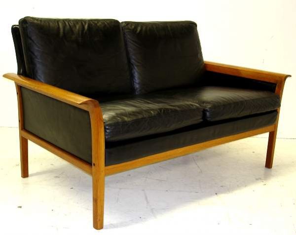 PR OF SWEDISH SETTEES, AMBER TEAK AND BLACK LEATH: PAIR OF SWEDISH SETTEES, AMBER TEAK AND BLACK LEATHER, 28 1/4"H, 51 1/2" X 30", SOME WEAR AND MARKS TO LEATHER