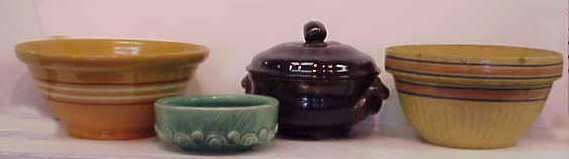 POTTERY LOT: YELLOW WARE BOWL (5"H X 11 1/2"D);: POTTERY LOT: YELLOW WARE BOWL (5"H X 11 1/2"D); YELLOW WARE BOWL (5 1/2"H X 10 1/2"D, SMALL CHIPS AT RIM); MCCOY PLANTER (2 3/4"H X 7"D) & COVERED BOWL (7"H X 8"D BOWL)