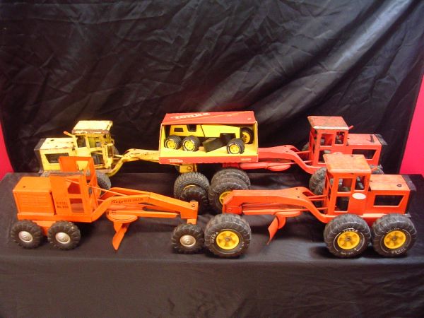 1960'S TO 1970'S TONKA ROAD GRADER LOT OF 5: 1960'S TO 1970'S TONKA ROAD GRADER LOT OF 5 INCLUDES 1962 PRESSED STEEL OMAHA ORANGE DIESEL ROAD GRADER (TONKA ID#600) 17"L 6 1/2"W 7"H. GRADER HAS 6 GOOD TIRES & HUBCAPS. ORIGINAL SCRAPER TURNS EASIL