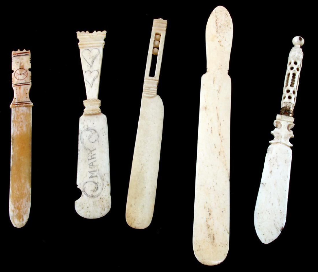 5 BONE FOLDER BLUNT LETTER OPENERS: Between 6.25" and 9.25". The largest is plain. One is marked "Mary" with hearts, One has a hollow handle with three free movnig balls, one has simple geoetric patterns. and one is ornately carved. All