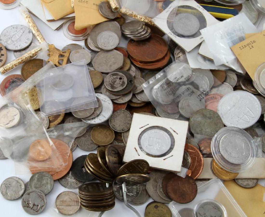 8.2 POUNDS OF WORLD COINS TOKENS & NUMISMATICA: One of our most popular offerings. Over 8 pound of world and U.s coins and or coin related items, some silver and who knows what else.