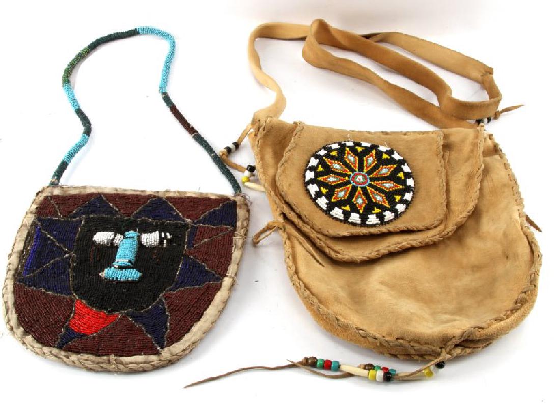 2 BEADED NATIVE AMERICAN LAKOTA MEDICINE MAN BAGS: Grouping of 2 Native American beaded medicine man bags: the first bag is hand-sewn and made entirely of brain-tanned cow hide and bears a hope star emblem made of shakira beads (has lost some stitchin