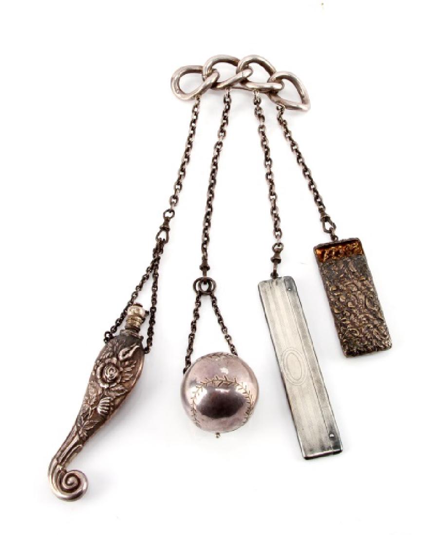 AMERICAN STERLING SILVER CHATELAINE WITH BASEBALL: American chatelaine from early 20th century. Chainlink-style brooch with four chains. The most unusual is a very rare hinged baseball that open for storage. Also has a Whiting comb, a lided perfume vi