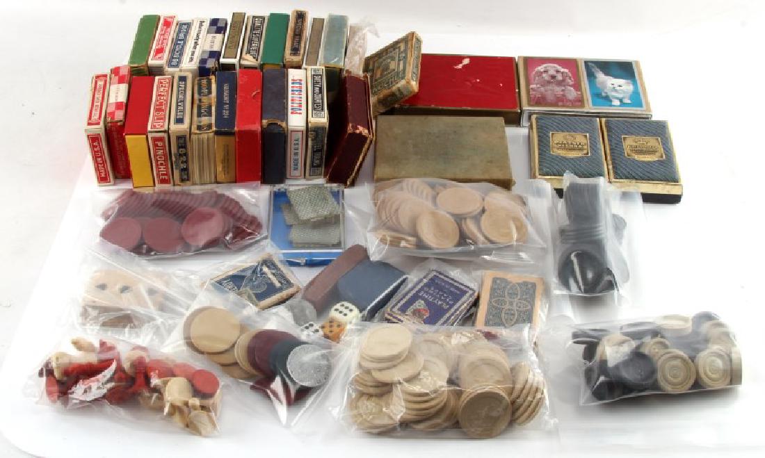 VINTAGE GAMING CARDS CHIPS CHESS CHECKERS DICE: Fairly unsearched collection of gaming items including 60 decks of cards, bone chess and checkers pieces, and bone poker dice. Decks of cards range in age from the 1920s or earlier to at least 2005 wi