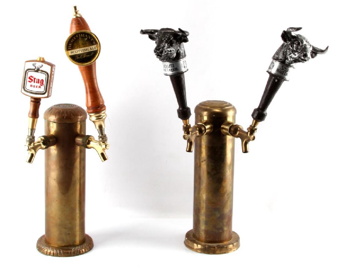 2 PIECE LOT OF VINTAGE BRASS 2 LINE BEER TAPS: 1st tap has Bert Grant's Scottish ale handle & Stag. and has 2 Schlitz Malt Liquor handles. 14" tall without handles. 4" diameter opening on the bottom.