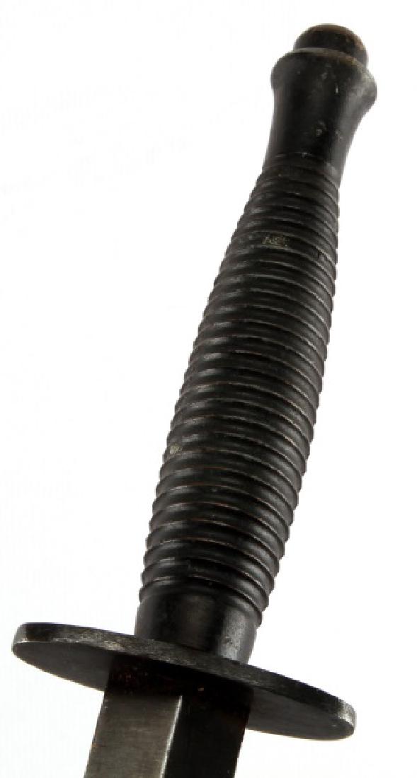 WWII FAIRBAIRN SYKES 3RD PATTERN FIGHTING: Stamped England on top of crossguard for export, mold pattern 3 stamped on hilt, 6.5 inch blade near mint condition. With unmarked leather scabbard, elastic has snapped otherwise good