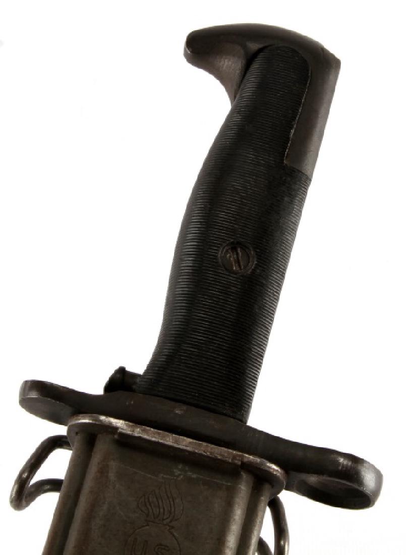 WWII US M1 GARAND RIFLE BAYONET UTICA CUTLERY CORP: WWII era US M1 rifle bayonet. Made by Utica Cutlery Corp, 1940's to 50's. Maker stamped to blade, 9.75 inches, sharp tip, very good. "H" marked to hilt. Flaming grenade with US marked to scabbard. Ver