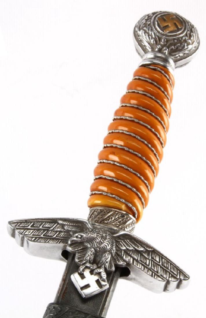 WWII GERMAN LUFTWAFFE 2ND MODEL DAGGER WKC: WWII Nazi German Second Model Air Force dagger, WKC maker. Excellent 10 inch WKC Solingen blade, orange bakelite wire wrapped grip, and aluminum fittings. Solid construction. Scabbard is fully intact 