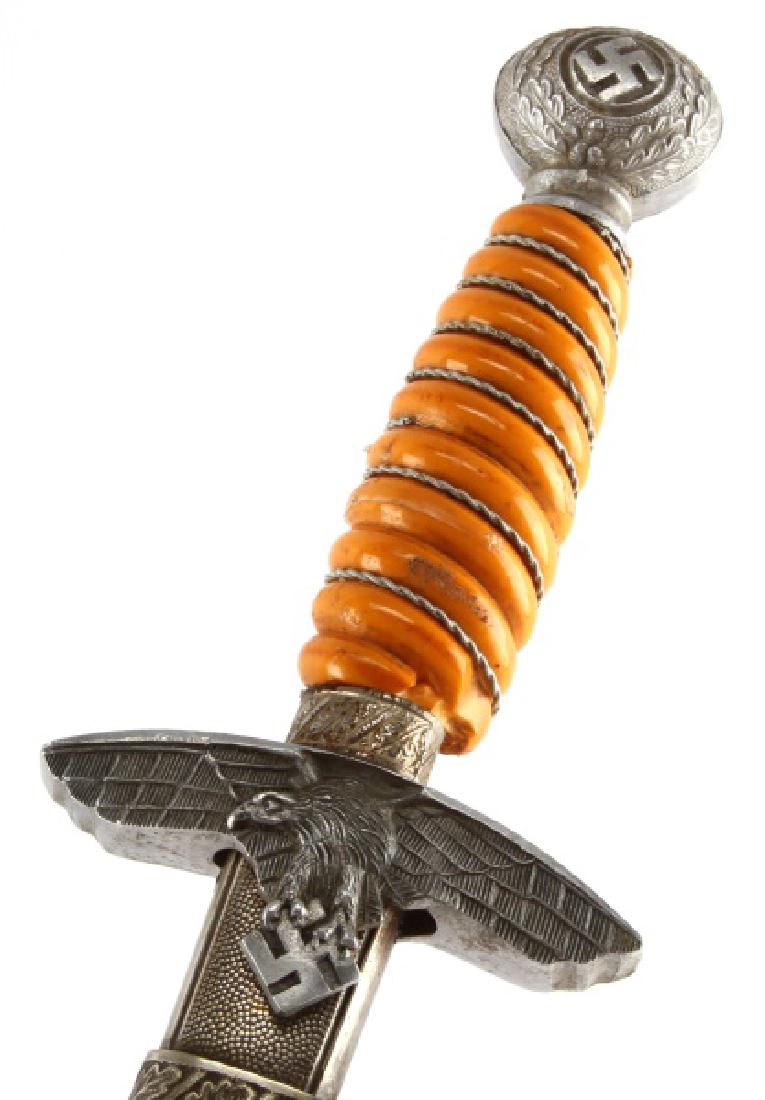 WWII THIRD REICH GERMAN 2ND MOD LUFTWAFFE DAGGER: WWII Nazi German Second Model Air Force (Luftwaffe) dagger. Unmarked 10 inch blade with some patination and smooth to touch. Bakelite wire wrapped grip has damage: missing wire, cracks and loss to gri